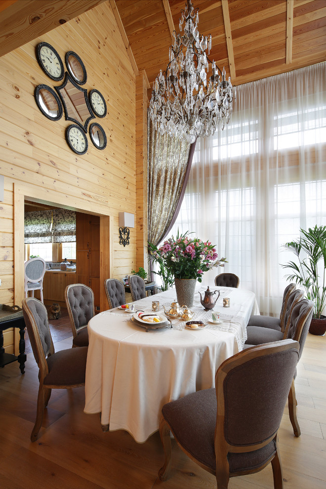 Rural dining room in Moscow with medium hardwood flooring.