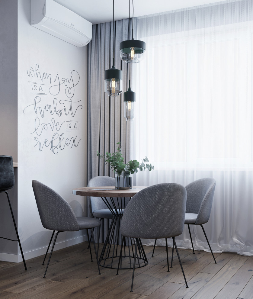 Свежая идея для дизайна: гостиная-столовая среднего размера в современном стиле с полом из ламината, коричневым полом и серыми стенами - отличное фото интерьера