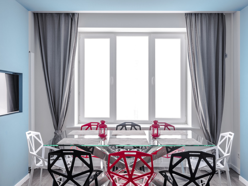 Идея дизайна: кухня-столовая среднего размера в современном стиле с синими стенами