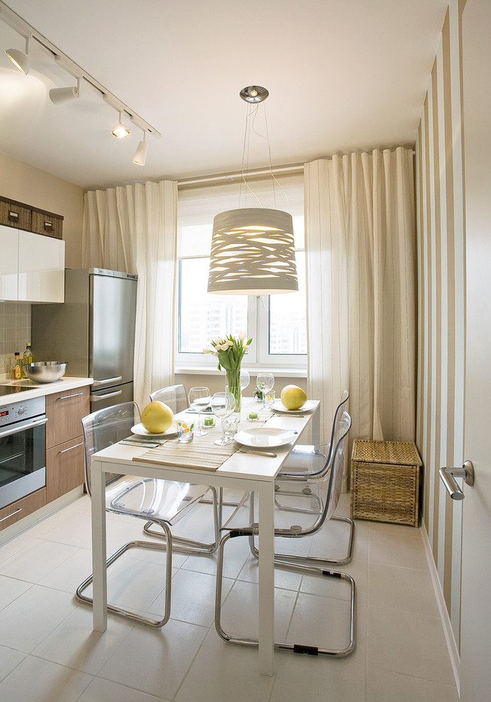 Стильный дизайн: кухня-столовая среднего размера в современном стиле с белыми стенами - последний тренд