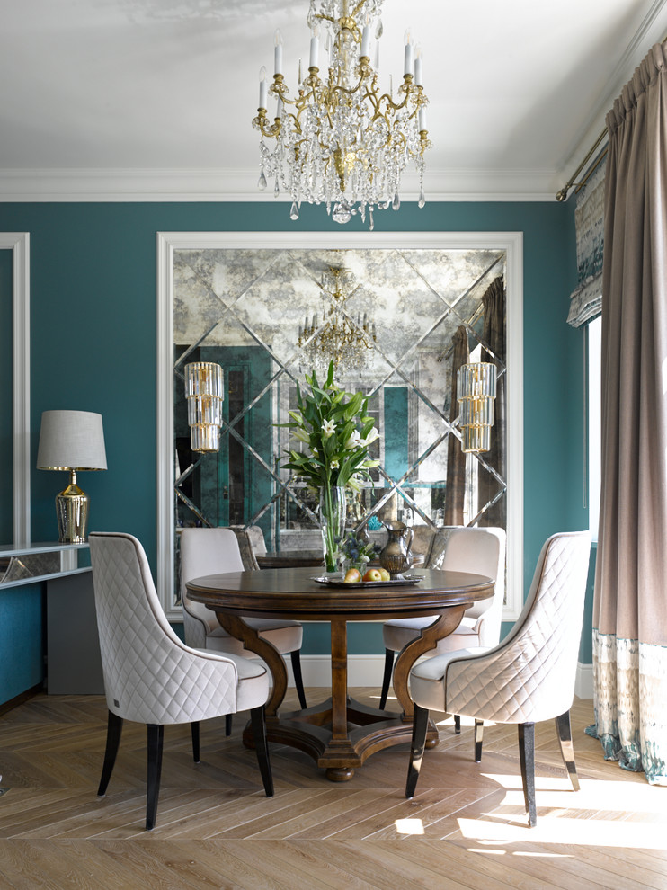 Example of a transitional light wood floor and beige floor dining room design in Moscow with blue walls