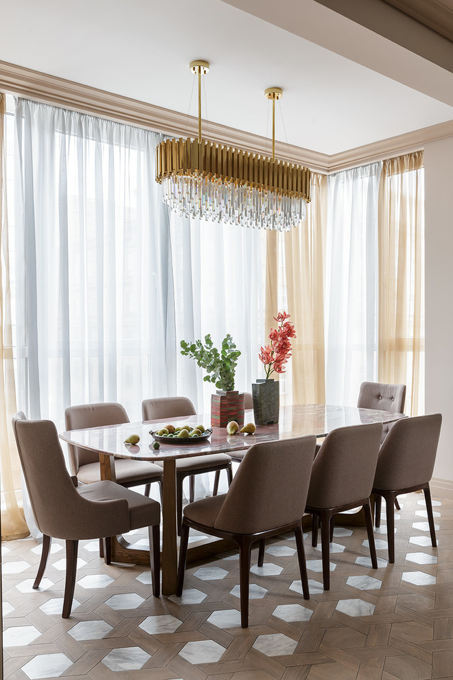Example of a small transitional porcelain tile and brown floor dining room design in Saint Petersburg with beige walls