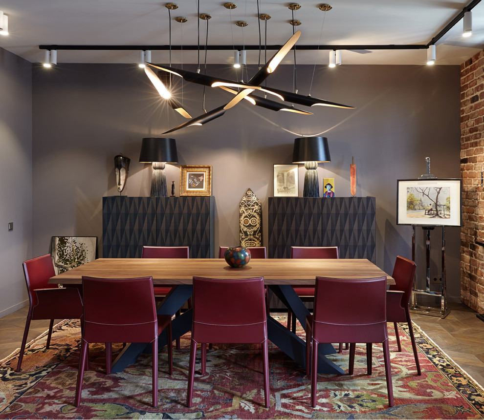 Photo of an eclectic dining room in Moscow with grey walls, carpet and feature lighting.