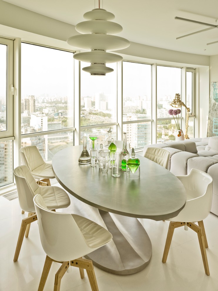 Immagine di una sala da pranzo aperta verso il soggiorno design con pareti bianche e nessun camino
