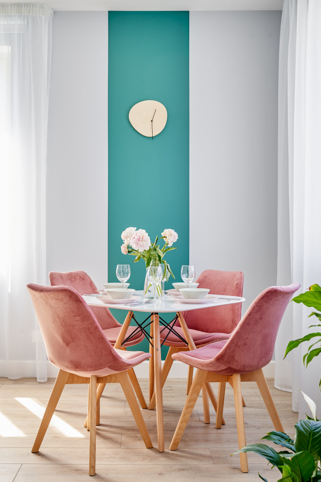 Design ideas for a small scandinavian dining room in Saint Petersburg with multi-coloured walls, light hardwood flooring, no fireplace and beige floors.