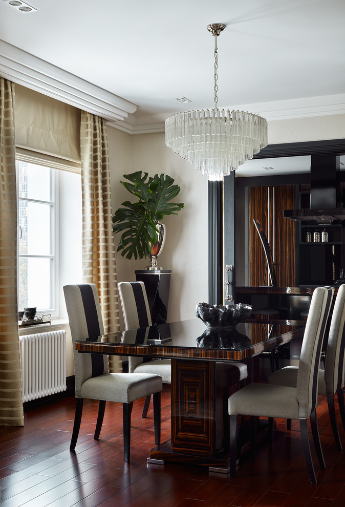 Photo of a classic dining room in Moscow with beige walls, dark hardwood flooring, brown floors and no fireplace.