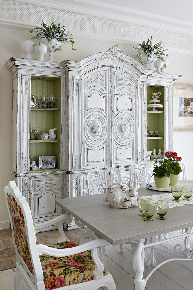 Shabby-chic style dining room in Moscow with white walls and painted wood flooring.