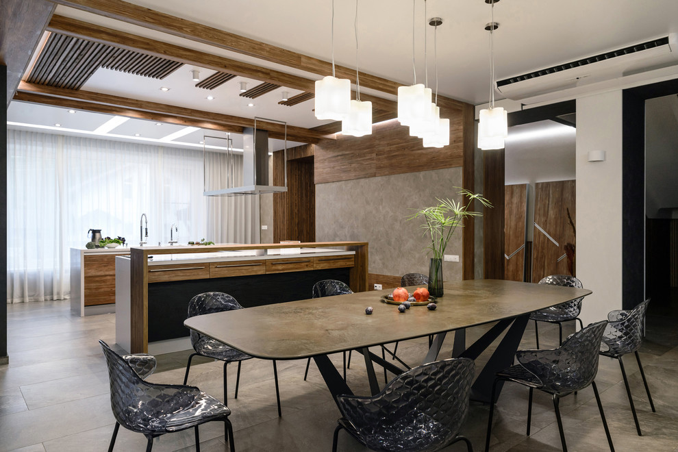 Стильный дизайн: кухня-столовая в современном стиле с белыми стенами и серым полом без камина - последний тренд