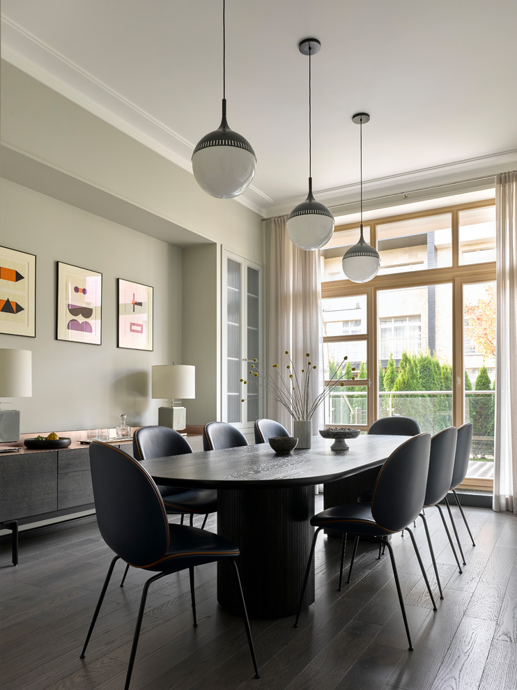 Inspiration for a modern enclosed dining room in Moscow with dark hardwood flooring, black floors, grey walls and feature lighting.