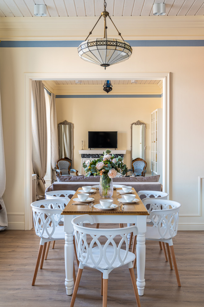 This is an example of a medium sized classic dining room in Saint Petersburg with beige walls, medium hardwood flooring, brown floors and a wood ceiling.