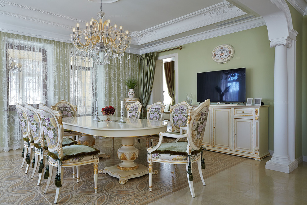 This is an example of a large traditional kitchen/dining room in Moscow with green walls and ceramic flooring.