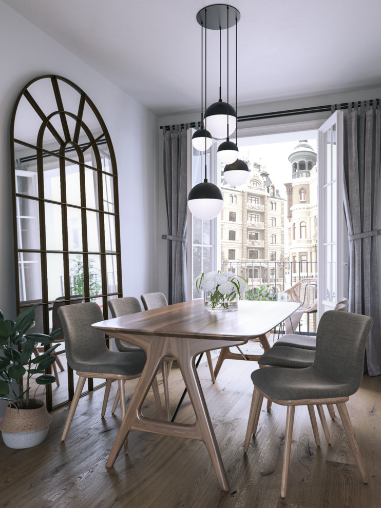 Idee per una sala da pranzo aperta verso la cucina nordica di medie dimensioni con pareti grigie, pavimento in legno massello medio e pavimento marrone