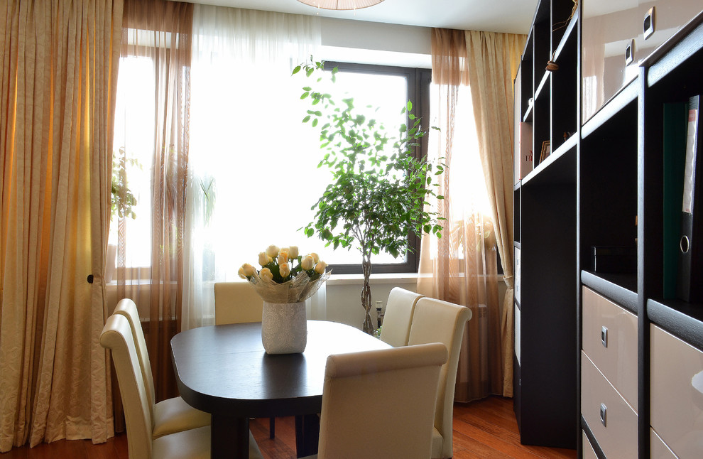 This is an example of a medium sized contemporary open plan dining room in Moscow with beige walls.