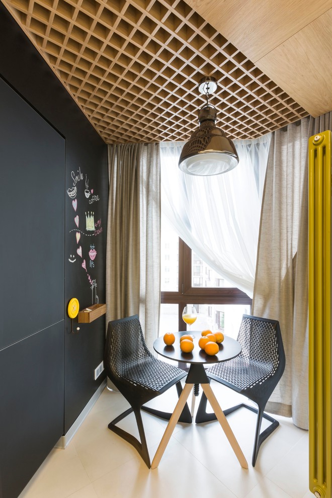 Contemporary enclosed dining room in Yekaterinburg with black walls.