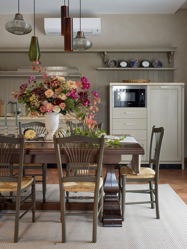 Medium sized traditional open plan dining room in Other with beige walls, ceramic flooring and brown floors.