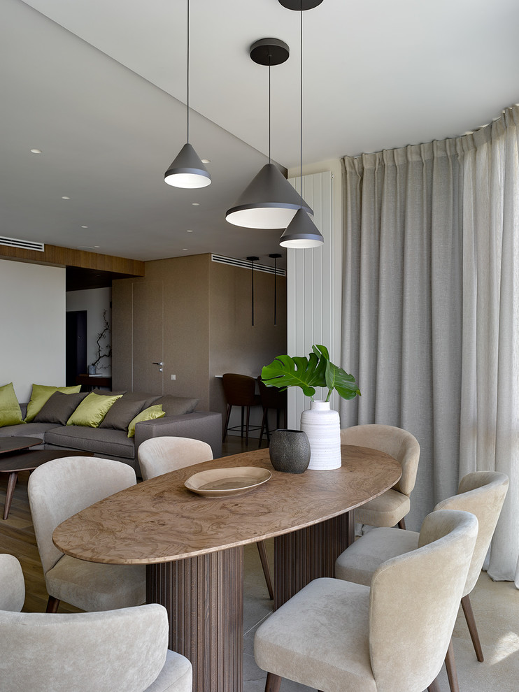 Esempio di una sala da pranzo aperta verso il soggiorno design