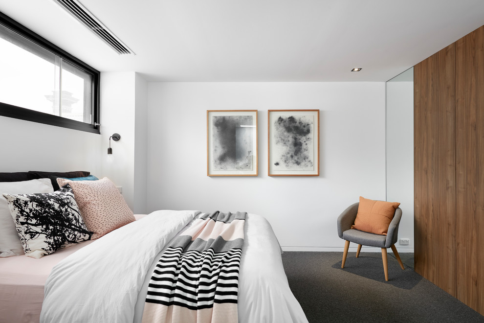 Mittelgroßes Modernes Schlafzimmer mit Teppichboden und grauem Boden in Melbourne