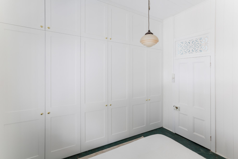 Design ideas for a medium sized traditional gender neutral standard wardrobe in Brisbane with shaker cabinets.