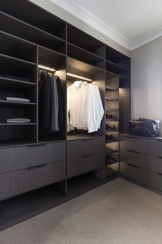 This is an example of a medium sized contemporary wardrobe in Sydney.