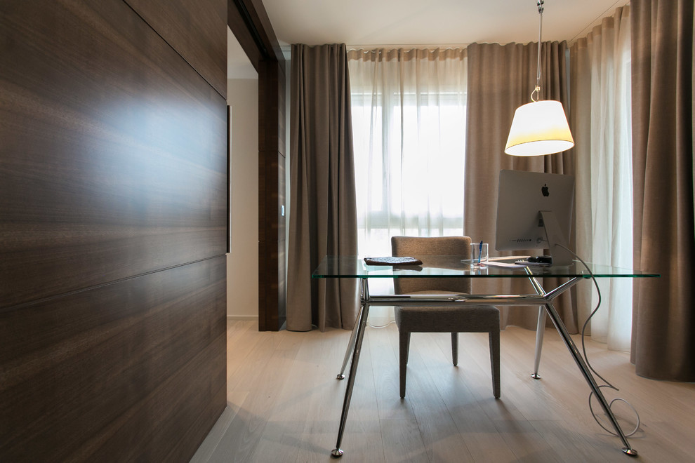 Study room - mid-sized contemporary freestanding desk light wood floor and beige floor study room idea in Milan