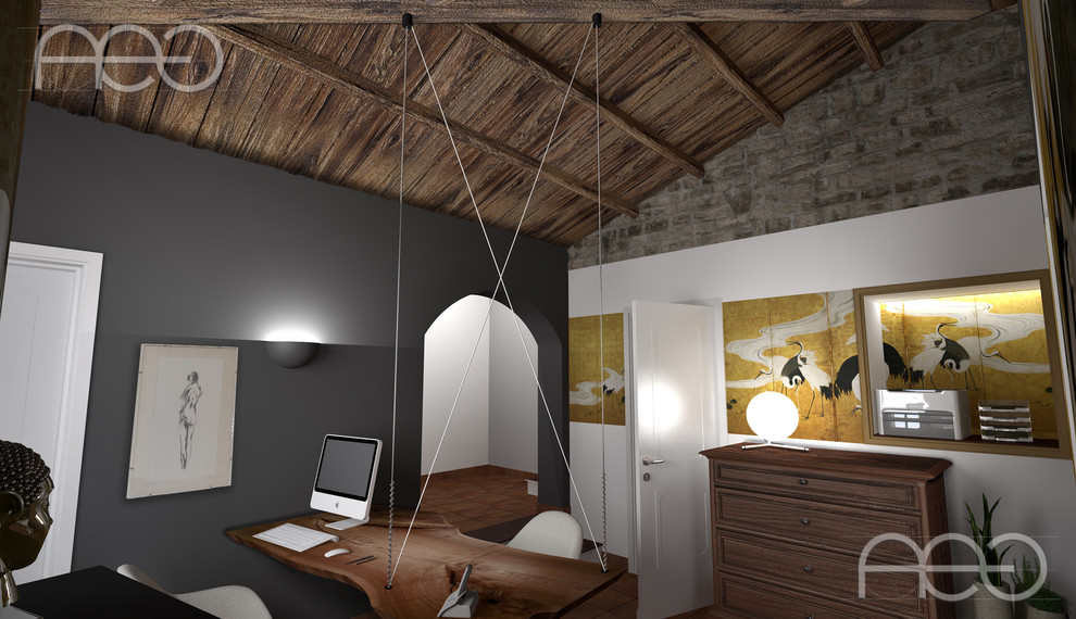 Mittelgroßes Mediterranes Arbeitszimmer mit Studio, Terrakottaboden, freistehendem Schreibtisch und orangem Boden in Turin
