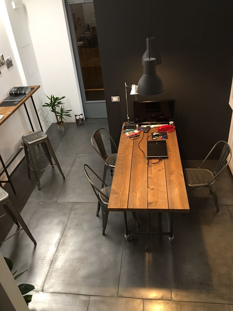 Small urban freestanding desk home studio photo in Other with gray walls