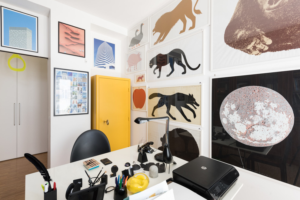 This is an example of a small eclectic home studio in Rome with a freestanding desk.
