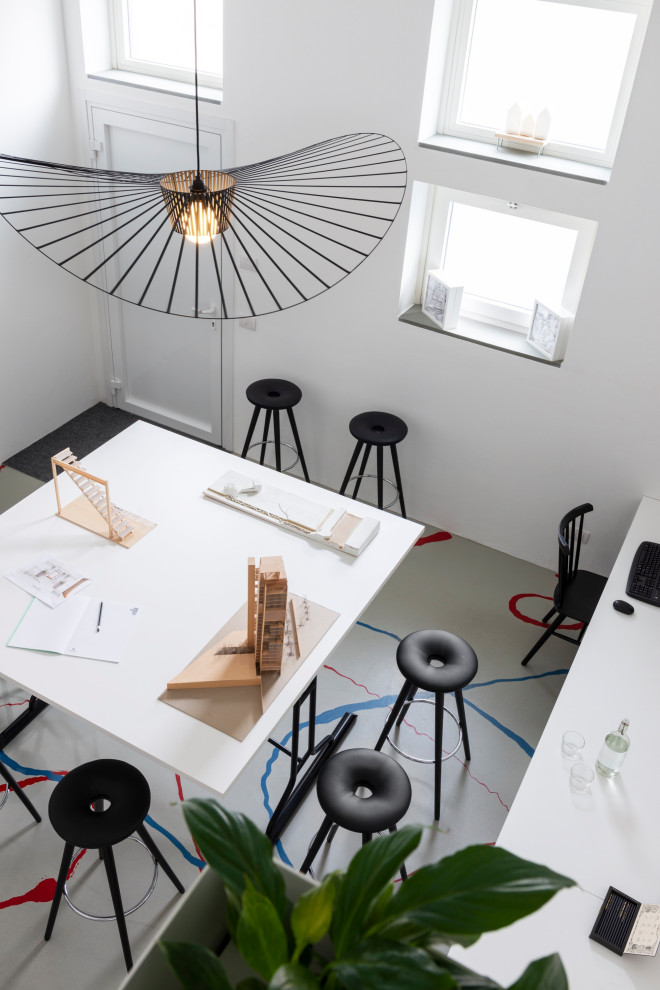 Photo of a small contemporary home studio in Milan with white walls, no fireplace and multi-coloured floors.