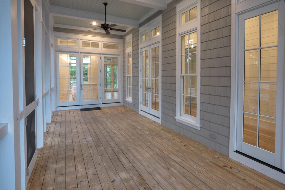 Inspiration for a mid-sized coastal light wood floor sunroom remodel in Miami with no fireplace and a standard ceiling