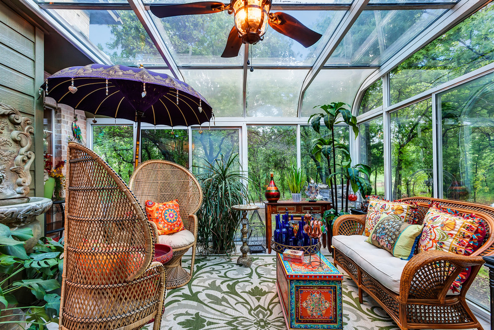 Example of an island style sunroom design in Dallas
