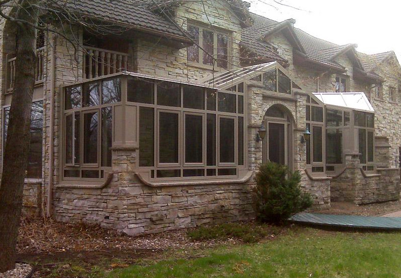 Foto di una grande veranda con soffitto in vetro