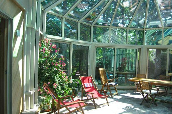 Design ideas for a large conservatory in Other with a glass ceiling.