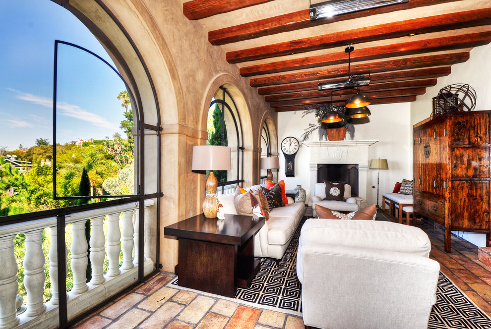 Large mediterranean conservatory in Orange County with a standard fireplace and a standard ceiling.