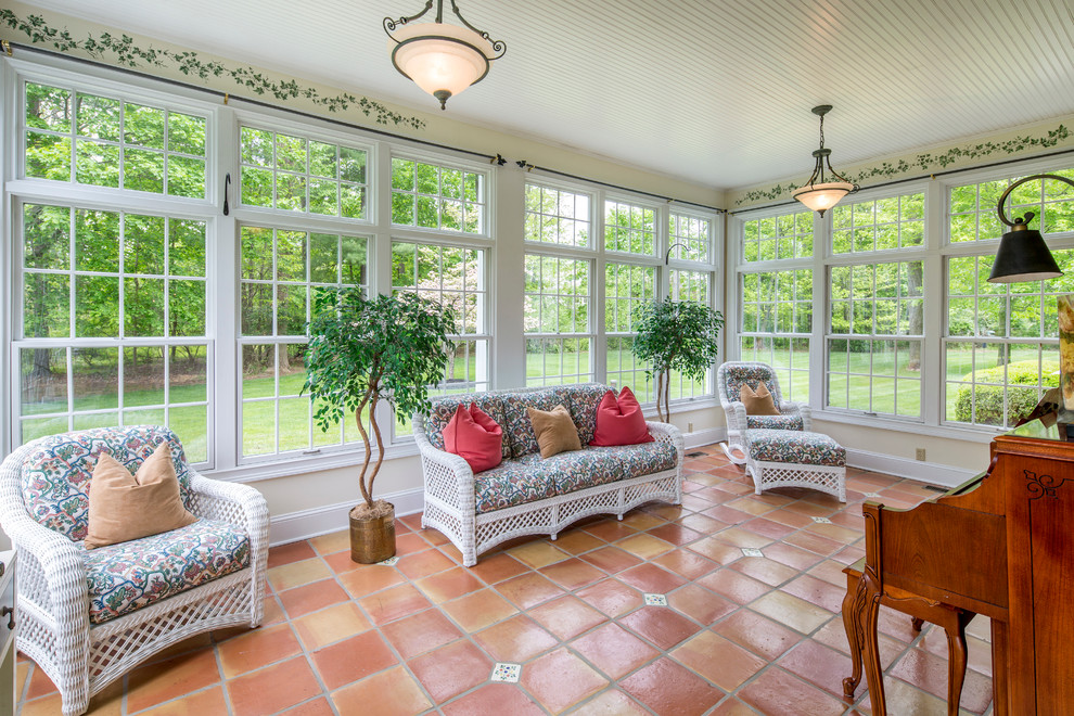 Example of a classic terra-cotta tile sunroom design in Philadelphia with a standard ceiling