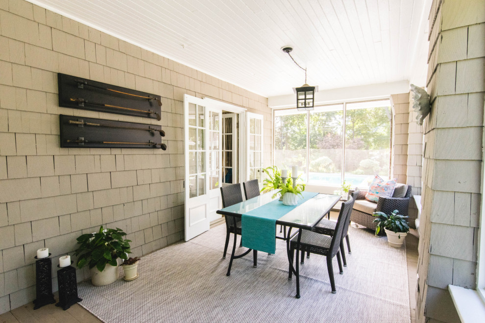 Photo of a large farmhouse conservatory in Montreal with plywood flooring, a standard ceiling and grey floors.