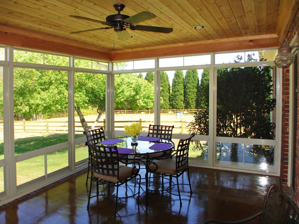 Mid-sized elegant concrete floor and brown floor sunroom photo in Other with a standard ceiling