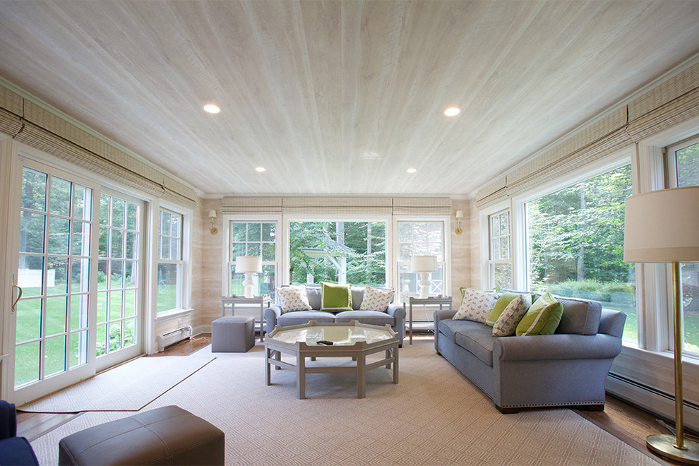 Inspiration for a mid-sized transitional medium tone wood floor and brown floor sunroom remodel in New York with no fireplace and a standard ceiling