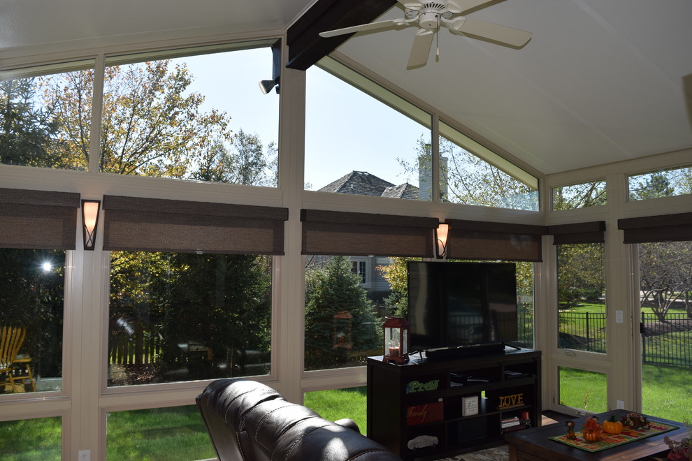 Photo of a medium sized classic conservatory in Chicago.