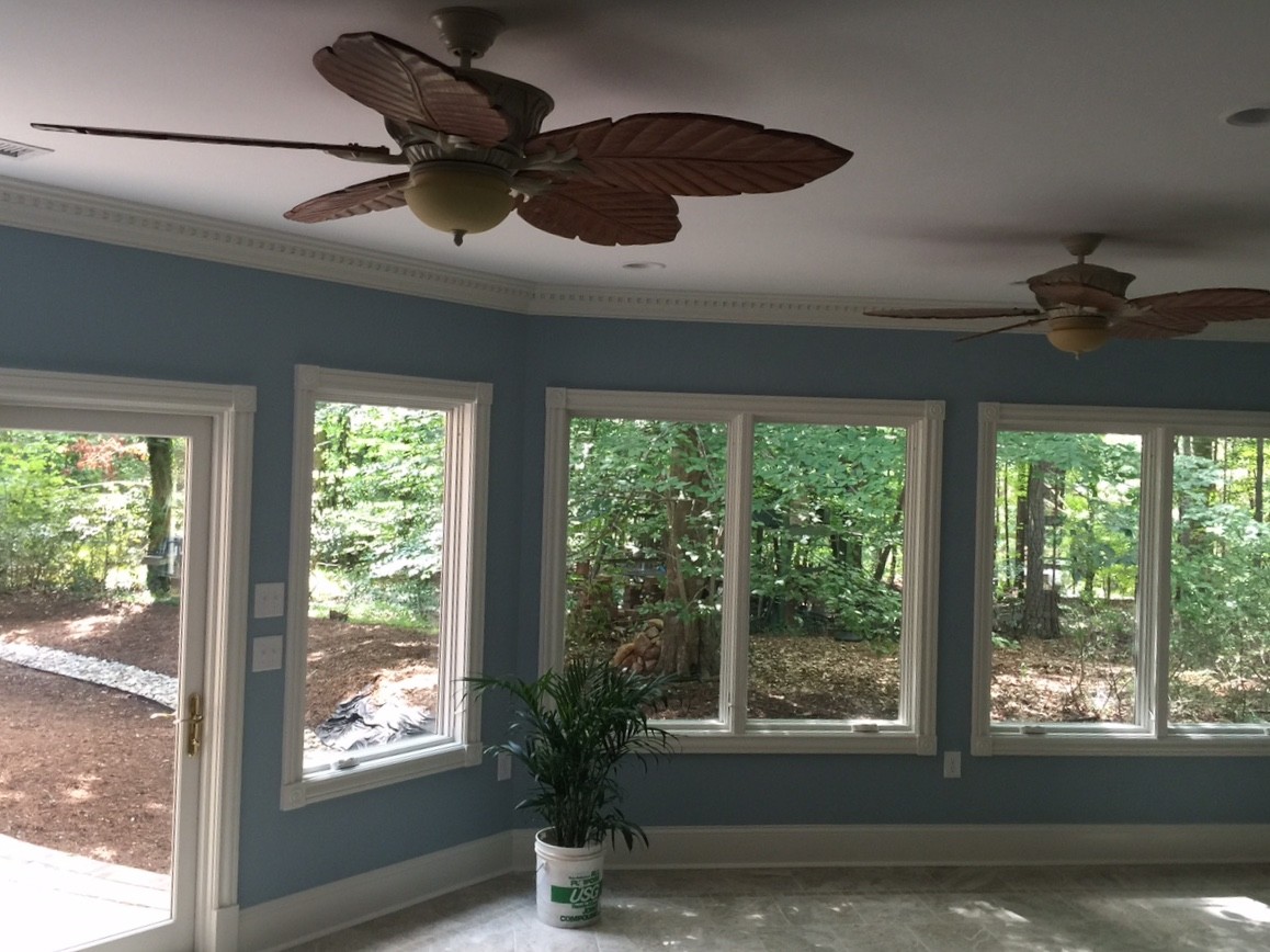 Design ideas for a classic conservatory in Raleigh with ceramic flooring, a standard ceiling and beige floors.