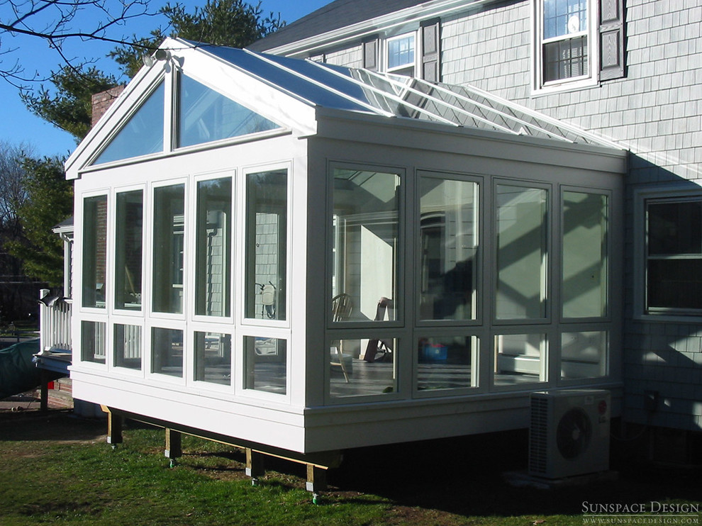 Idee per una veranda design di medie dimensioni con pavimento in ardesia, nessun camino e soffitto in vetro