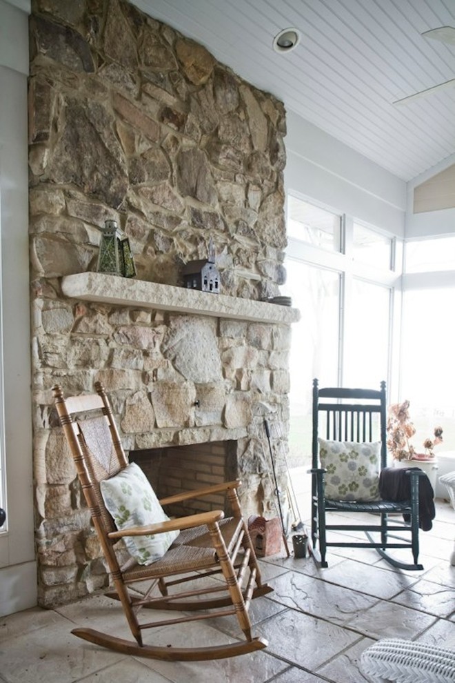 Mid-sized transitional ceramic tile and beige floor sunroom photo in Cleveland with a standard fireplace, a stone fireplace and a standard ceiling