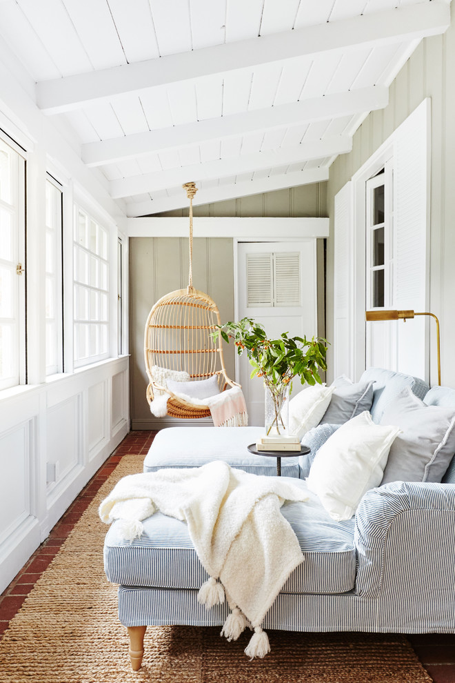 Example of a beach style brick floor sunroom design in San Francisco with a standard ceiling