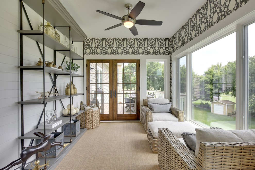 Esempio di una veranda country con moquette e soffitto classico