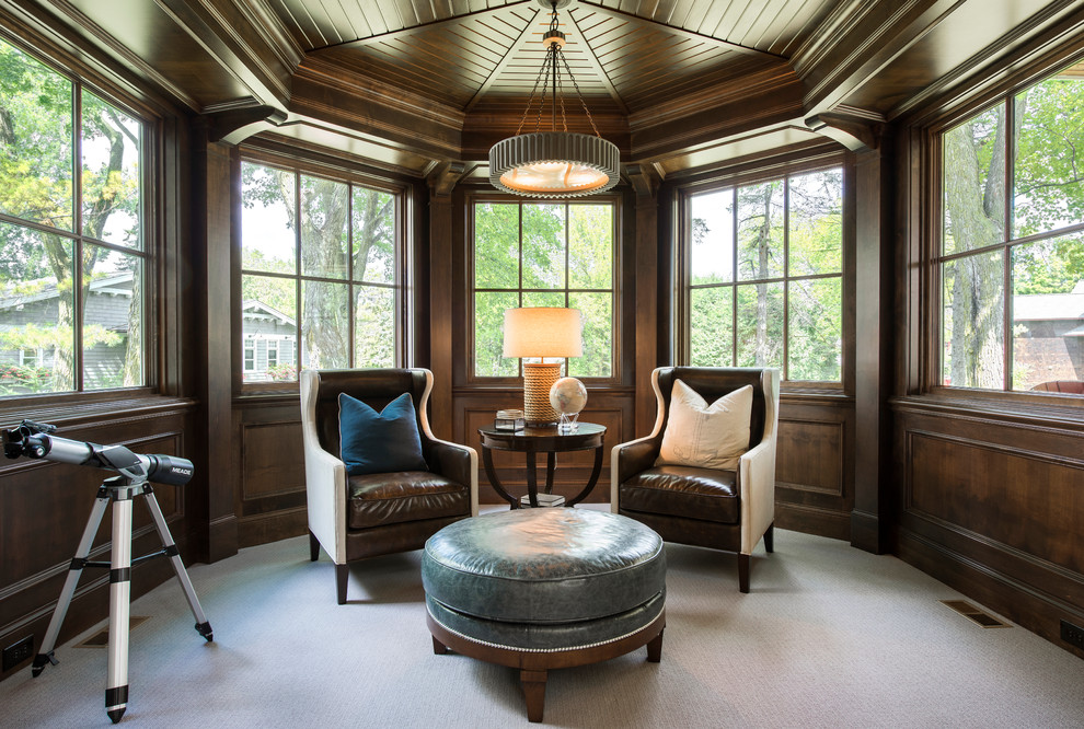 This is an example of a beach style conservatory in Minneapolis with carpet, a standard ceiling and beige floors.