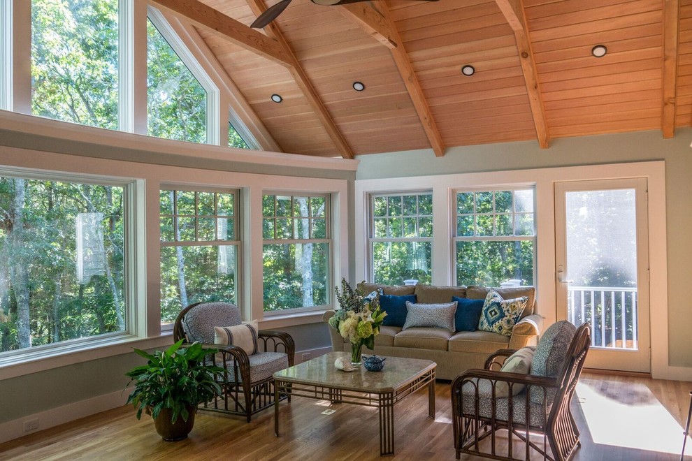Large elegant medium tone wood floor and brown floor sunroom photo in Boston with no fireplace and a standard ceiling