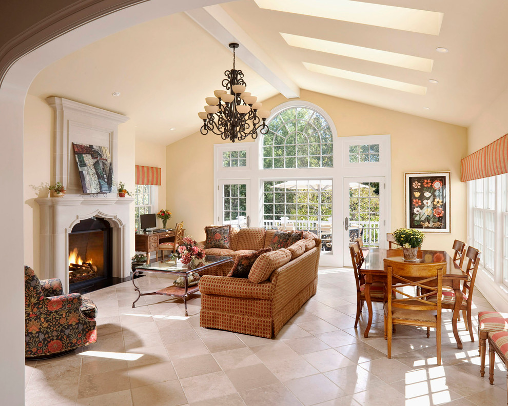 Large traditional conservatory in Milwaukee with ceramic flooring, a standard fireplace, a stone fireplace surround and a skylight.