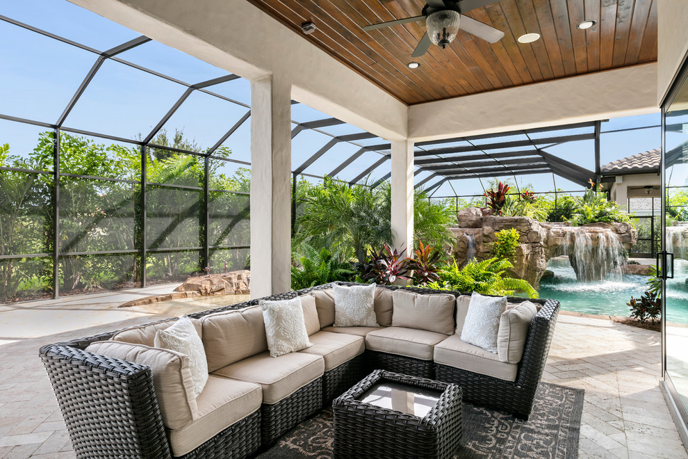 Example of a huge tuscan sunroom design in Orlando