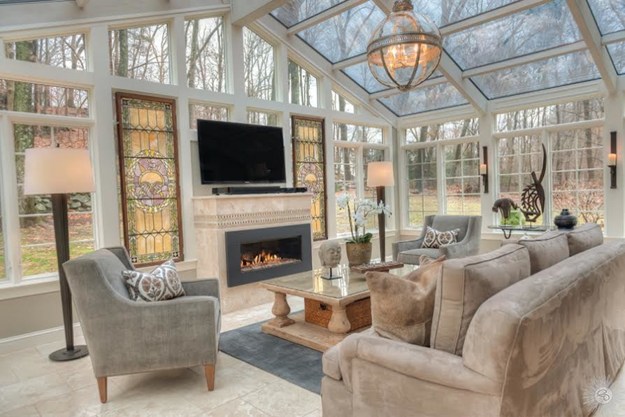 Design ideas for a large eclectic conservatory in New York with marble flooring, no fireplace, a stone fireplace surround, grey floors and a skylight.