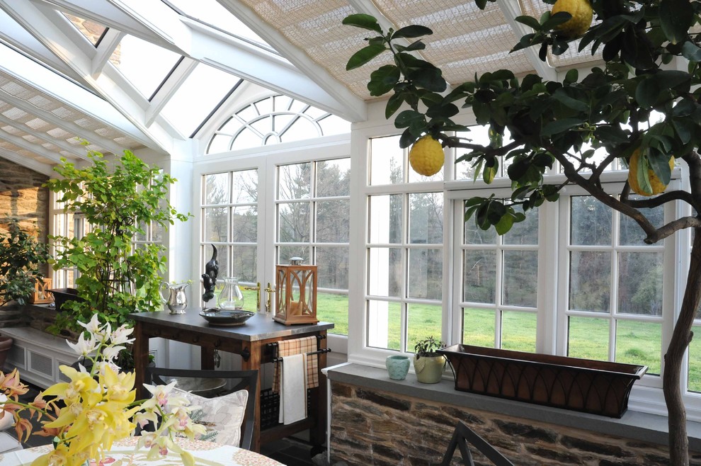 Inspiration for a large timeless slate floor sunroom remodel in Philadelphia with a glass ceiling