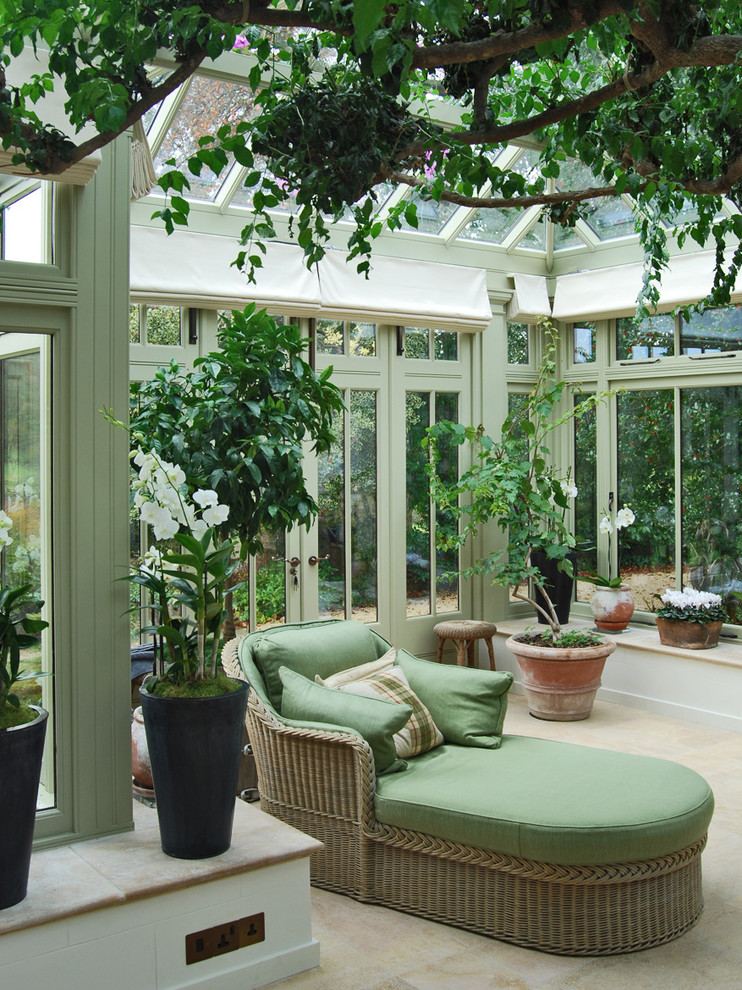 This is an example of a medium sized mediterranean conservatory in Chicago with a glass ceiling.